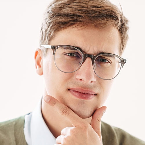 thoughtful young guy student in eyeglasses 4FG5USN 1